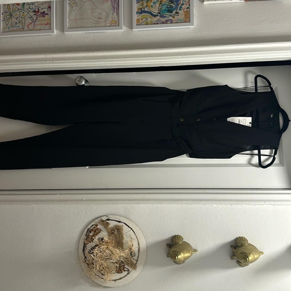Zara jumpsuit. Black vest open back and sides.